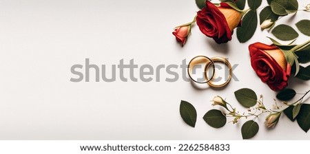 Creative love concept. Pink red rose petals stalks with pair of gold wedding ring band. soft background. Wedding. proposal. Valentine's Day. Flat lay, top view, copy space	

