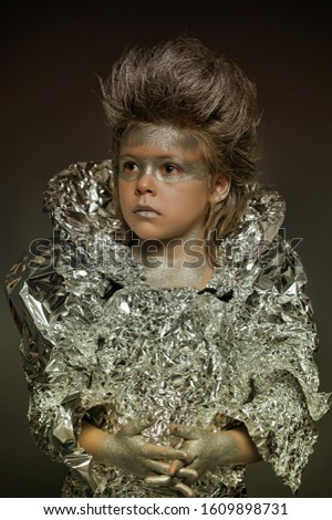 creative make-up, a boy in a silver suit