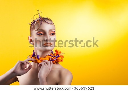Creative make-up and hairstyle. Portrait of young girl