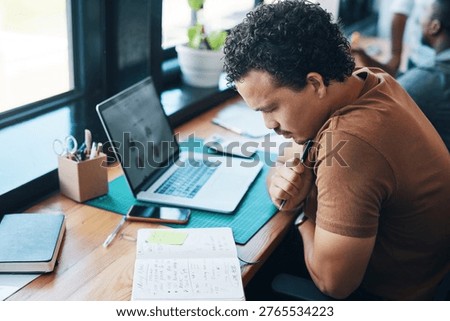 Creative, man or thinking with notebook in office for campaign brief, typography ideas or laptop notes. Tech, graphic designer or journal review for branding guidelines, project overview or coworking
