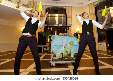 Creative Master Bartender Mixologists Juggling Bottles And Shakers At Wedding Reception