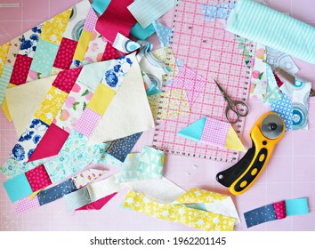 Creative Mess: Fabric Scraps, Scissors, Rotary Cutter, Seam Ripper, Quilting Ruler And Cutting Mat