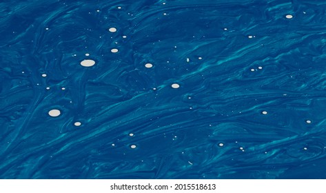 Creative metalic blue background   white dots made paint   nail polish 
