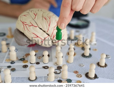 Creative minds at work exploring cognitive functions with brain models and wooden figures