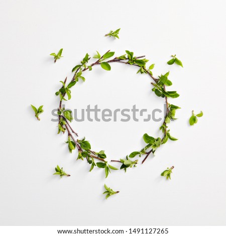 Similar – Green wreath with flowers and plants on white