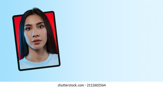 Creative Modern Design. Portrait Of Beautiful Young Girl Looking Out Tablet Screen Isolated Over Blue Background. Concept Of Online Comunication, Cooperation, Education, Fashion, Youth Culture And Ad