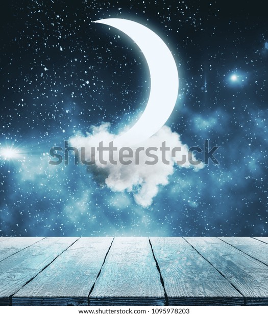 Creative moon in starry sky background. Imagination and\
dreams concept 