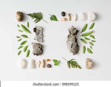 Creative Natural Layout Made Of Leaves, Stones, And Tree Bark On White Background. Flat Lay.