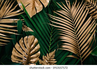 Creative Nature Background. Gold And Green Tropical Monstera And Palm Leaves. Minimal Summer Abstract Jungle Or Forest Pattern.