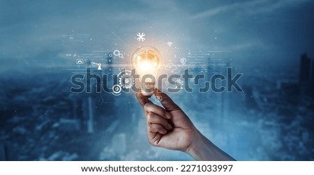 Creative, new ideas and innovation, Hand holding light bulb and smart brain inside and innovation icon network connection on dark blue city background, innovative technology in science and industrial.