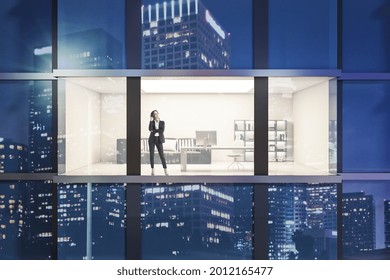 Creative Night Time Glass Building Exterior With Window And Thoughtful Young Businesswoman In Office Interior View. Future And Tomorrow Concept