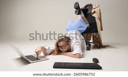 Creative office worker in surreal pose against white studio background, representing challenge of staying productive under stress. Concept of work chaos, unconventional workspaces, digital overload