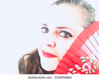 Creative Overexposed Portrait Of A Woman With Gray Eyes With A Spanish Fan