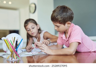 Creative, painting and kids at table together for growth, fun development or homeschool for sibling bonding. Art, craft and children drawing with watercolor, brush and teamwork project in living room - Powered by Shutterstock