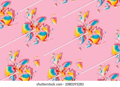 Creative pattern of broken in pieces lollipops on pastel pink background, top view. Sugar detox, no sugar and junk food concept. - Shutterstock ID 2080293283