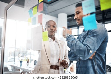 Creative people, thinking and meeting for schedule planning, brainstorming or team strategy at the office. Man and woman in teamwork decision for project plan, tasks or sticky note ideas in startup - Powered by Shutterstock