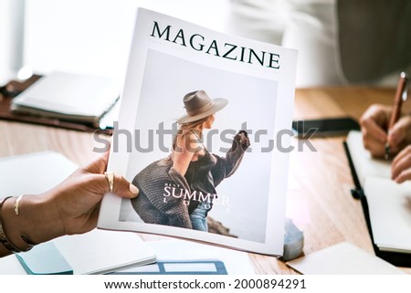 Creative people working on magazine cover design