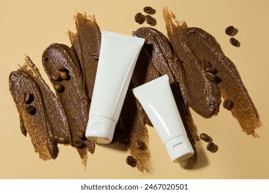 Creative photo of coffee ingredient for manufacturing exfoliating scrubs with two white sample of cosmetic container flat lay on dark brown color scrub texture. Top view photo, copy space - Powered by Shutterstock