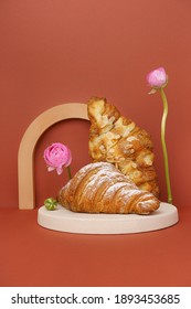 Creative Photo Of Fresh Croissant With Flower.  Still Life Photo Croissant