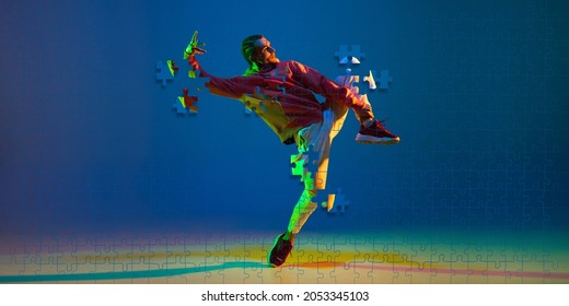 Creative Portrait Of Young Male Dancer Training Over Gradient Blue Background In Neon. Portrait Consist Of Puzzle Pieces. Concept Of Art, Creativity, Sport, Action, Imagination. Copy Space For Ad