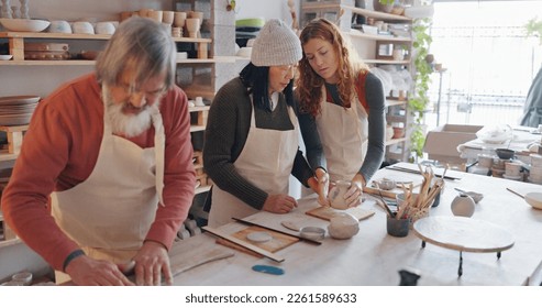 Creative pottery class, senior couple and teacher working together. Art, creativity and education, retirement hobby with clay for asian man and woman from Japan in workshop with girl teaching craft. - Powered by Shutterstock