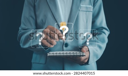 Creative problem solving and idea generation concept featuring a business professional writing in a notebook with question marks and a light bulb symbol, representing innovation, critical thinking.