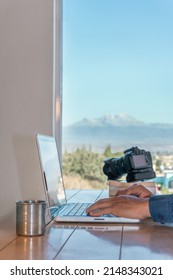 Creative professional using laptop at desk