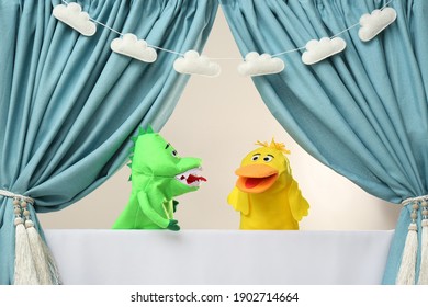 Creative Puppet Show On White Stage Indoors