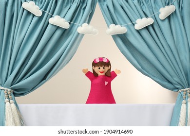 Creative Puppet Show On White Stage Indoors