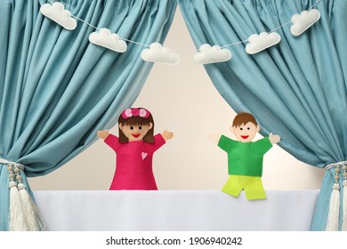 Creative Puppet Show On White Stage Indoors