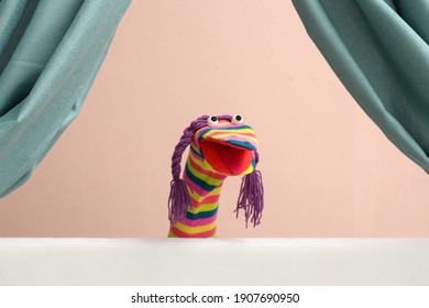 Creative Puppet Show On White Stage Indoors