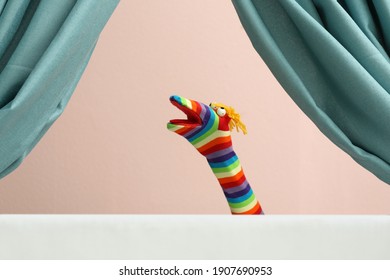 Creative Puppet Show On White Stage Indoors