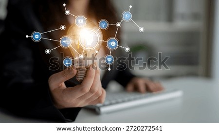 A creative representation of digital technology integration with a light bulb symbolizing innovative ideas and connections in a modern business environment. Tessel