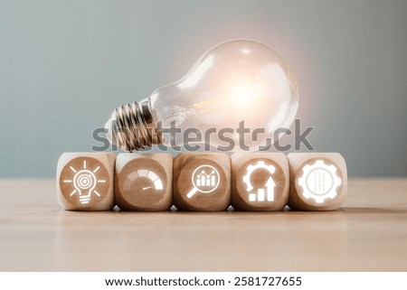 Creative representation of Six Sigma with light bulb and gear icons symbolizing quality management and process improvement.