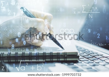 Creative scientific formula concept with hand writing in notebook on background with laptop. Multiexposure