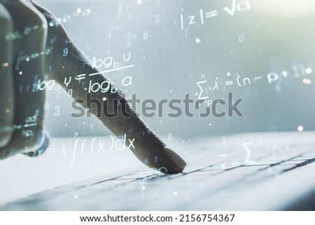 Creative scientific formula concept with hands typing on laptop on background. Multiexposure