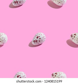 Creative seamless pattern with easter quail eggs on pink background. Sweet abstract background.