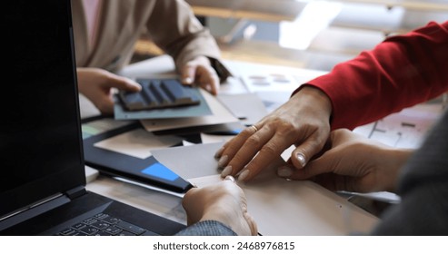 Creative session with fashion designers selecting fabric swatches. Team collaboration on color choices and textile planning. Professionals brainstorm innovative patterns and material selections. - Powered by Shutterstock