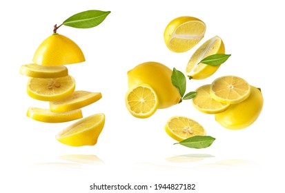 A creative set with Fresh raw whole and cut lemons with green leaves falling in the air isolated on white background. Food levitation or zero gravity conception. High resolution image - Shutterstock ID 1944827182