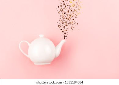 Creative Shot Of Star Shape Confetti Pouring Out From Tea Pot. Flatlay, Top View.