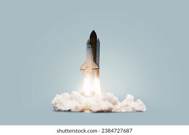 Creative shuttle rocket takes off successfully with blast and clouds of smoke on a blue background, concept. Spaceship launches, creative idea. Start up.
