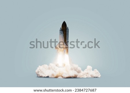 Creative shuttle rocket takes off successfully with blast and clouds of smoke on a blue background, concept. Spaceship launches, creative idea. Start up.