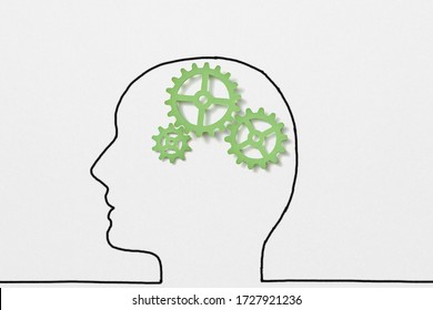 Creative Sketch With Drawn Outline Of Human Head With Green Clockwork Inside As A Working Brain On A White Background, Copy Space.