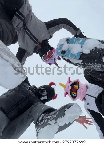 Creative Ski Boots Circle Perspective

Creative low-angle view of friends standing in a circle with ski boots touching together on snowy ground. Unique perspective symbolizing teamwork, friendship and winter adventure.