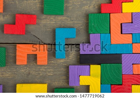 Creative solution for idea - business concept, jigsaw puzzle on the wooden background