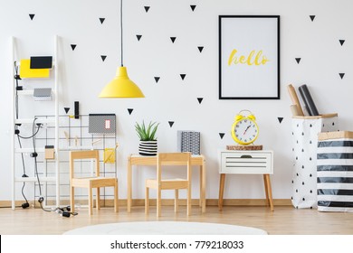 Creative Space For A Child With Yellow Lamp And Wooden Furniture