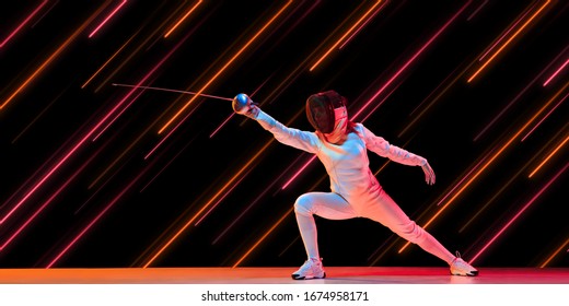 Creative Sport And Neon Lines On Dark Background, Flyer, Proposal. Female Fencing Player Training In Action And Motion. Concept Of Hobby, Healthy Lifestyle, Youth, Action, Movement, Modern Style.