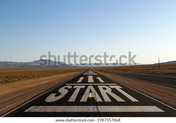 Creative start road on blue\
sky horizon background. Career development, startup and success\
concept