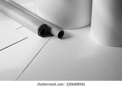 Creative Studio Space. Kraft Paper Rolls, Paper Sheets On Office Desk. Graphic Design Concept.