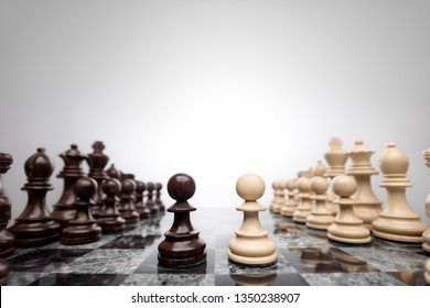 Creative success business concept meaningful photo of two pawns opposition in the middle of the checkerboard. - Shutterstock ID 1350238907